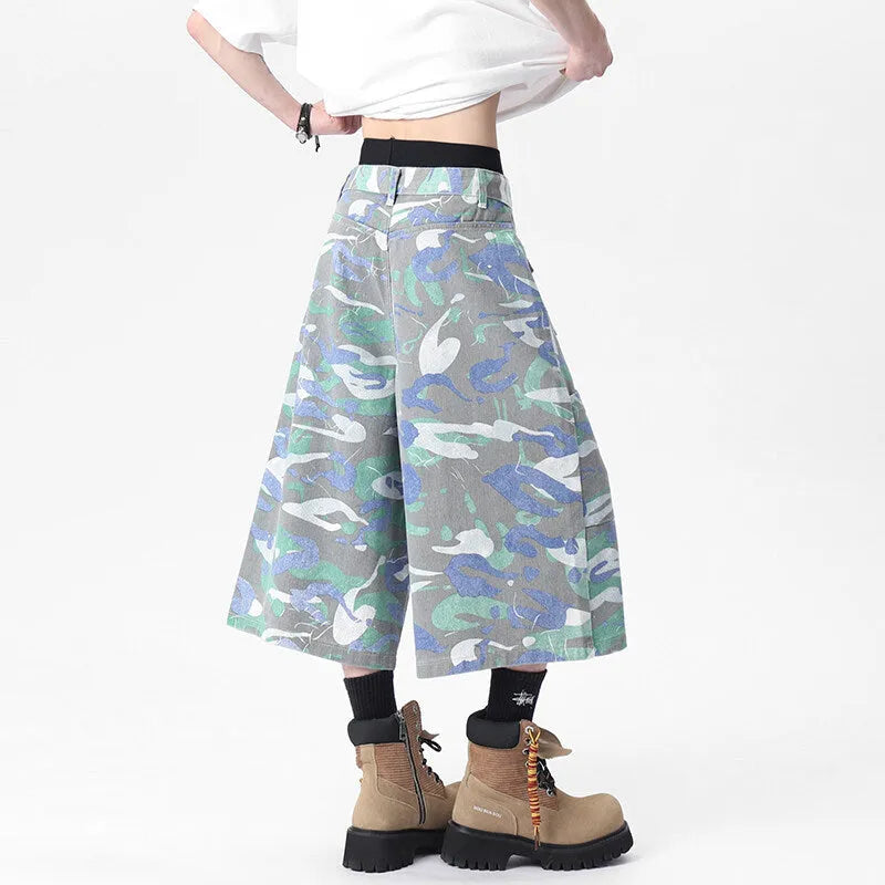 Men's camouflage colour denim cropped cargo trousers on a plain background