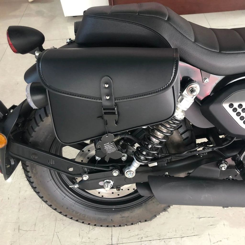 Black PU leather motorcycle swingarm saddlebag mounted on Sportster side