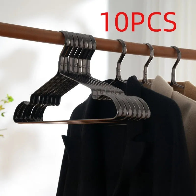 Elegant black metal clothes hanger with anti-slip and anti-rust coating on a white background.