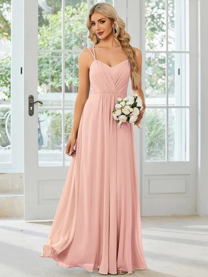Women's long sleeveless A-line dress with pleated skirt and sling neckline in light green colour