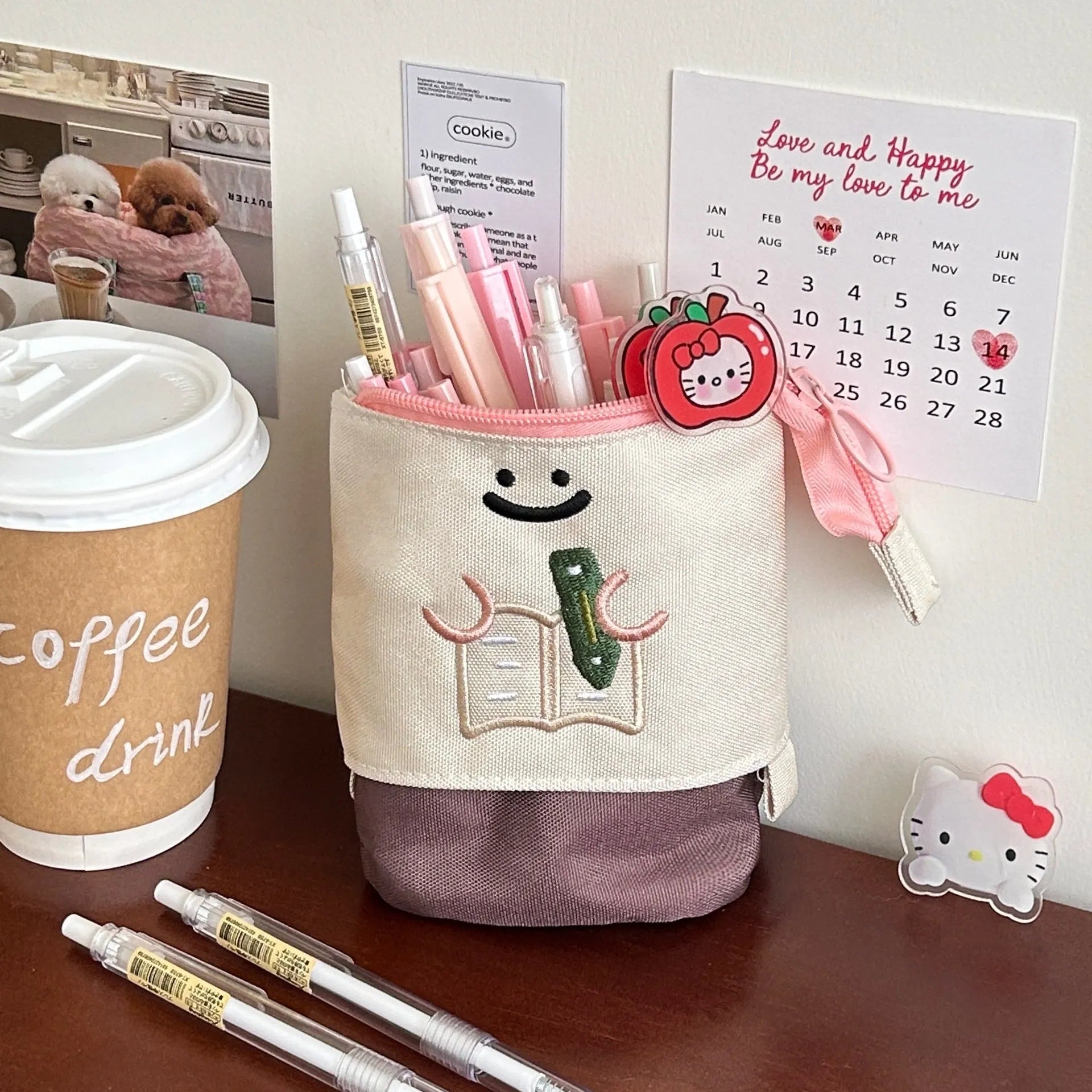 Korean style cartoon collapsible pencil case made from Oxford fabric in brown colour, shown with pens inside.
