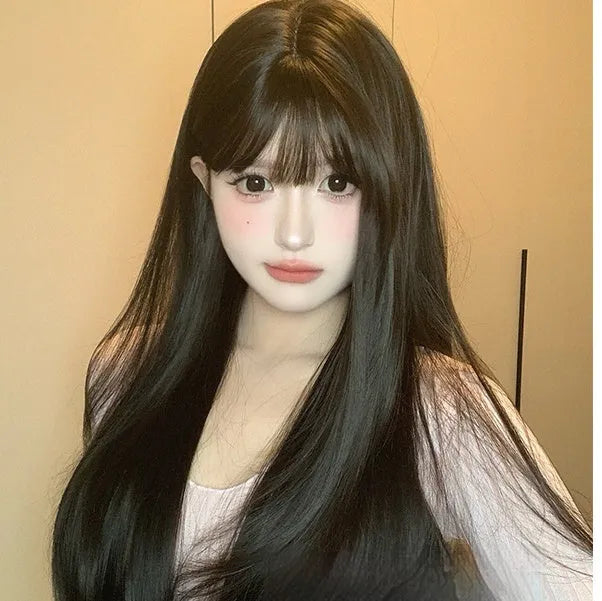 Dark brown full-head wig with long straight hair and bangs on display stand