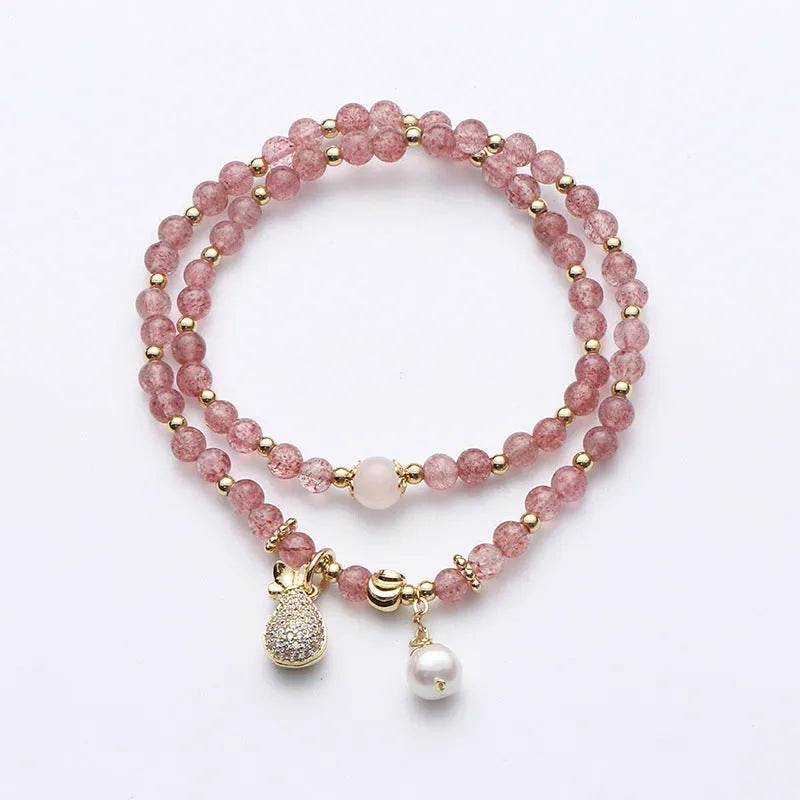 Women's strawberry quartz crystal bracelet with a geometry shape design.