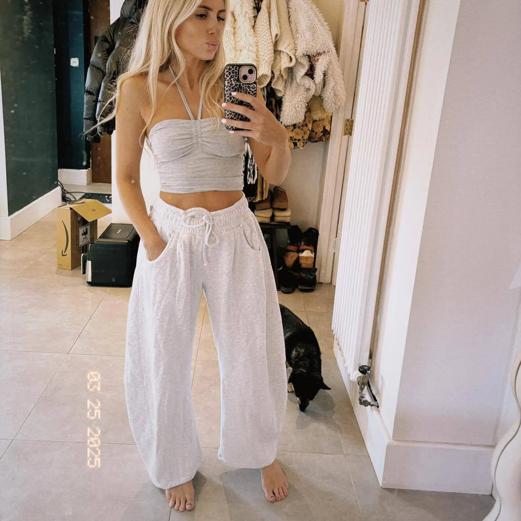Loose cropped sweatpants with drawstring elastic waist in street fashion styling