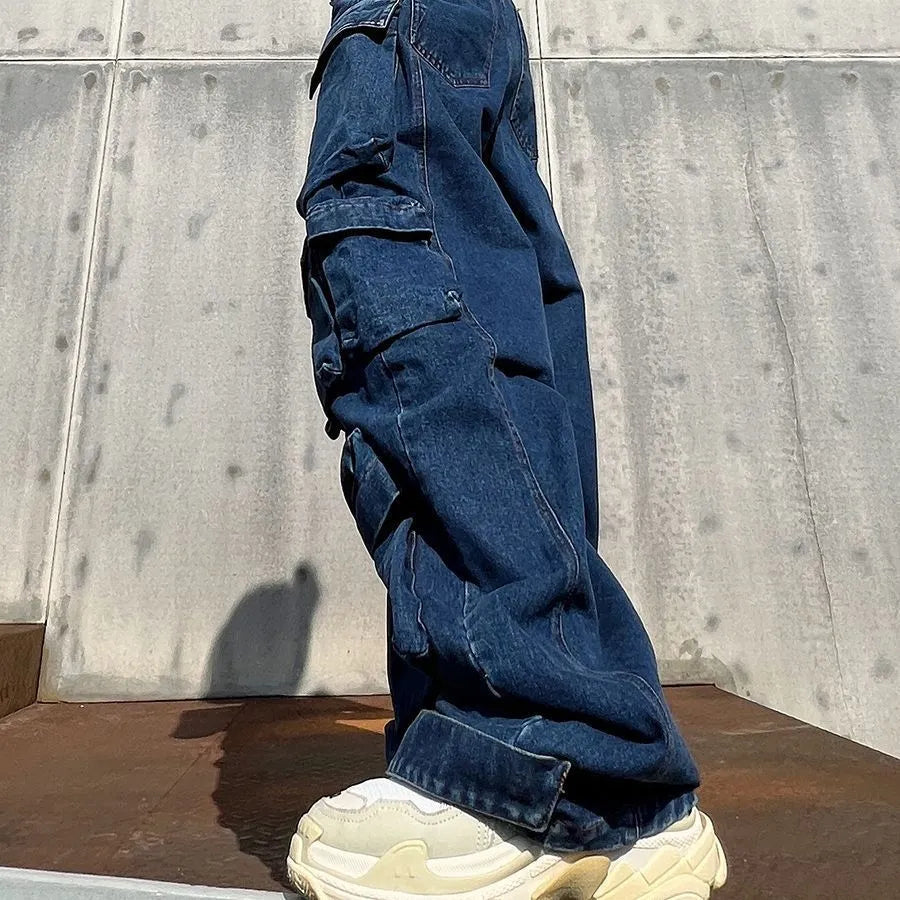 Dark blue distressed wide-leg high-waist jeans with multiple pockets on a mannequin.