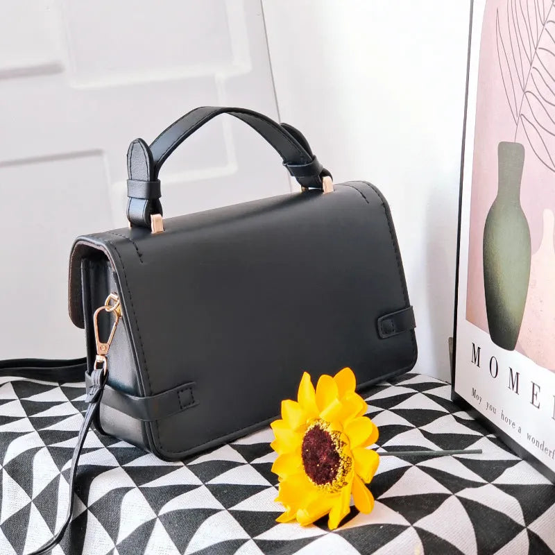 Retro ethnic pattern square crossbody bag in horizontal format with stitching detail and file bag interior