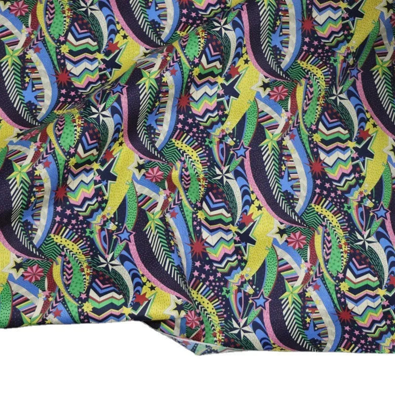 Blue cotton fabric with digital floral printing showing plant designs