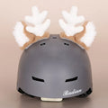 Soft plush ski helmet decoration hat with cartoon design on a blue background.