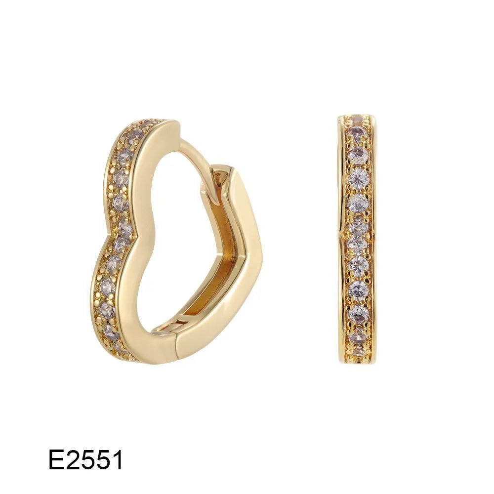 Brass gold plated heart-shaped ear clip earrings with gang drill details on copper construction
