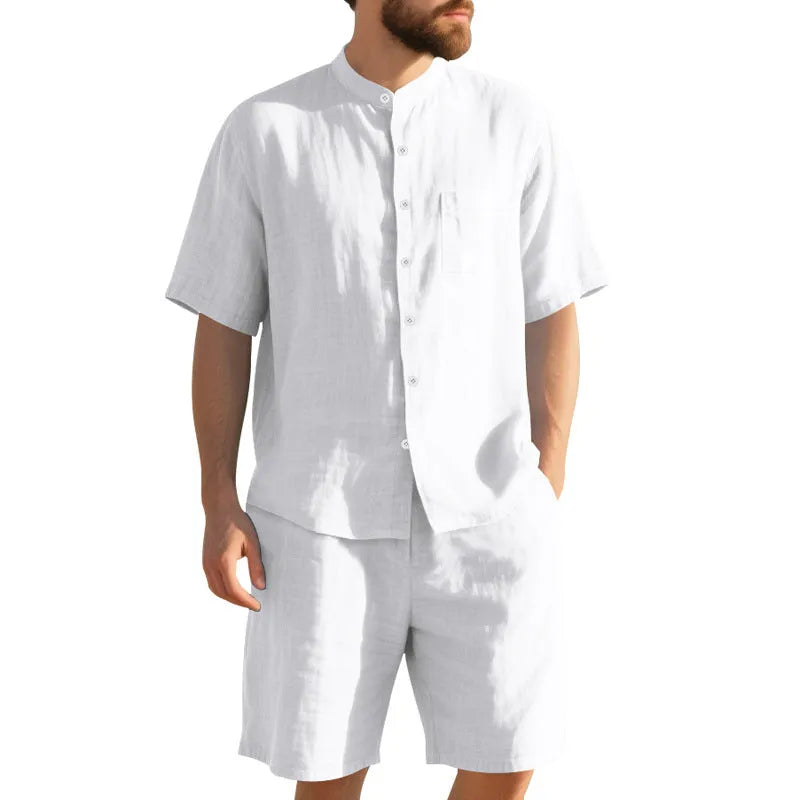 Men's light blue linen two-piece suit with short sleeve jacket and shorts on a hanger.
