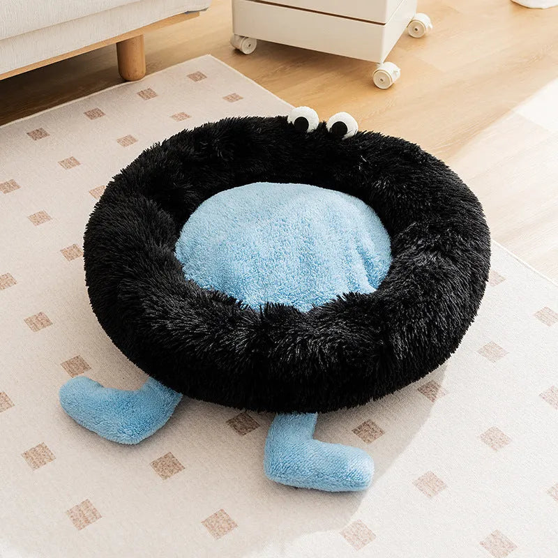 Elf Briquettes blue plush pet bed mat inside a dog crate