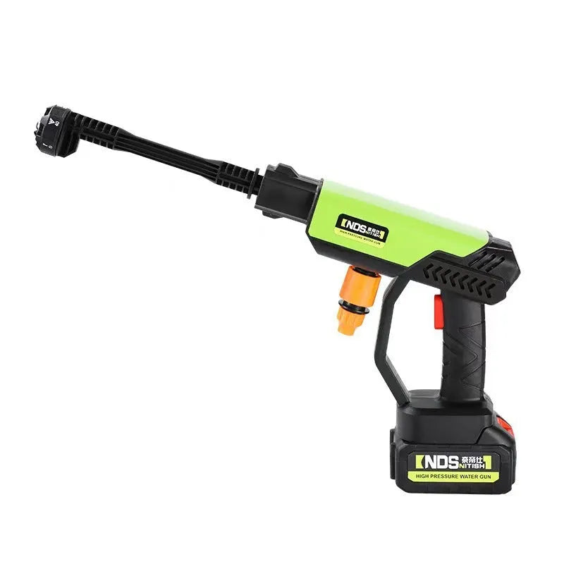 Green wireless high-pressure water gun with multiple nozzle attachments on a yellow toolbox