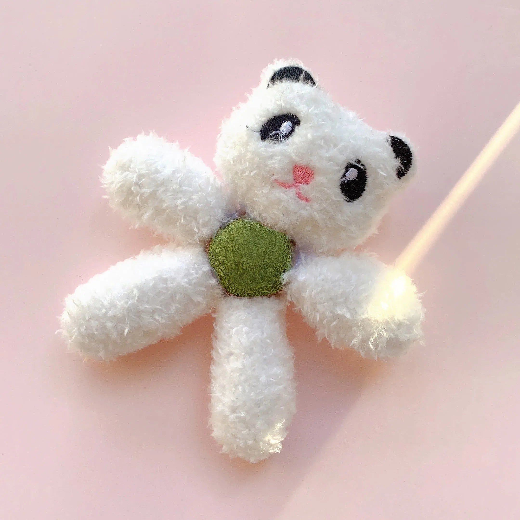 Plush catnip ball chewing toy in animal designs for dental care, showing scale next to a 12.5 cm ruler.