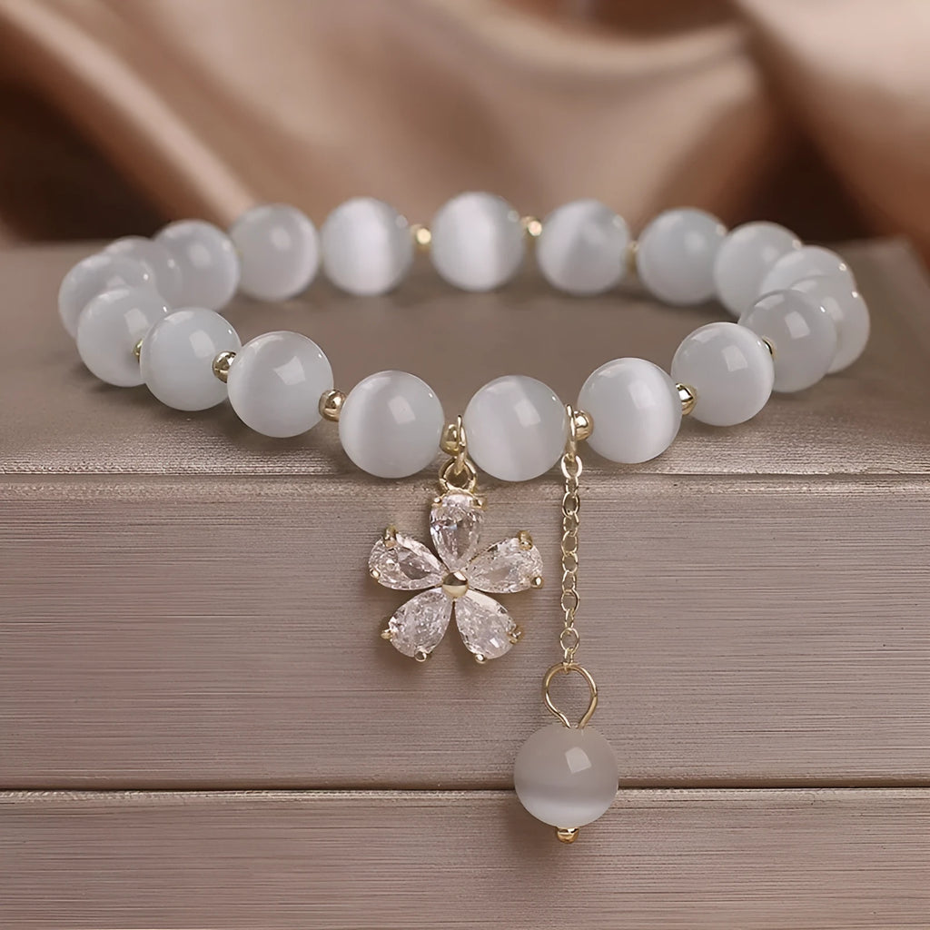 Women's white cat's eye crystal bracelet with flower tassels and morganite safety buckle pendant