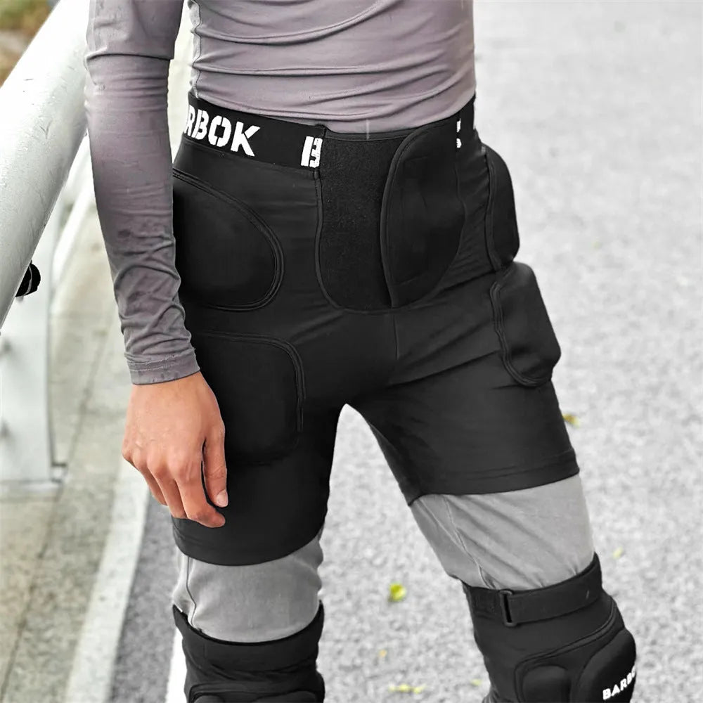 Adult black spandex hip pad pants with built-in protective padding for roller skating and skateboarding.