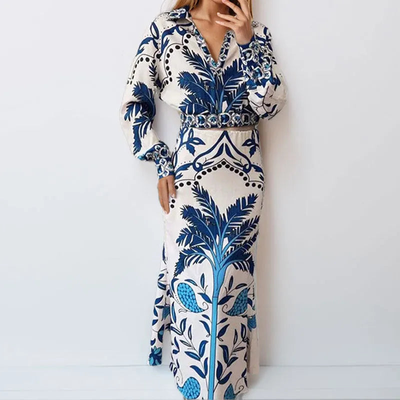 Women's long sleeve top and long skirt two-piece co-ord set in a solid colour.