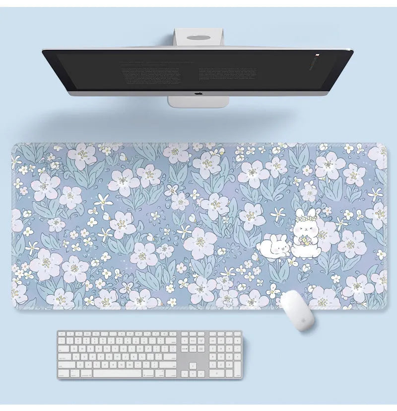 Floral pattern mouse pad on desk with keyboard, showing non-slip rubber base and colourful flower design