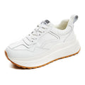 Women's white leather casual sports shoes with cross strap and English muffin heel detail