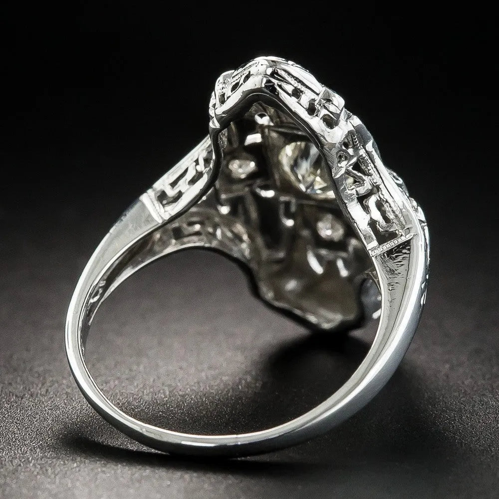 Hollow geometric silver-coloured ring with diamond-studded cubic zirconia stones, shown in profile view