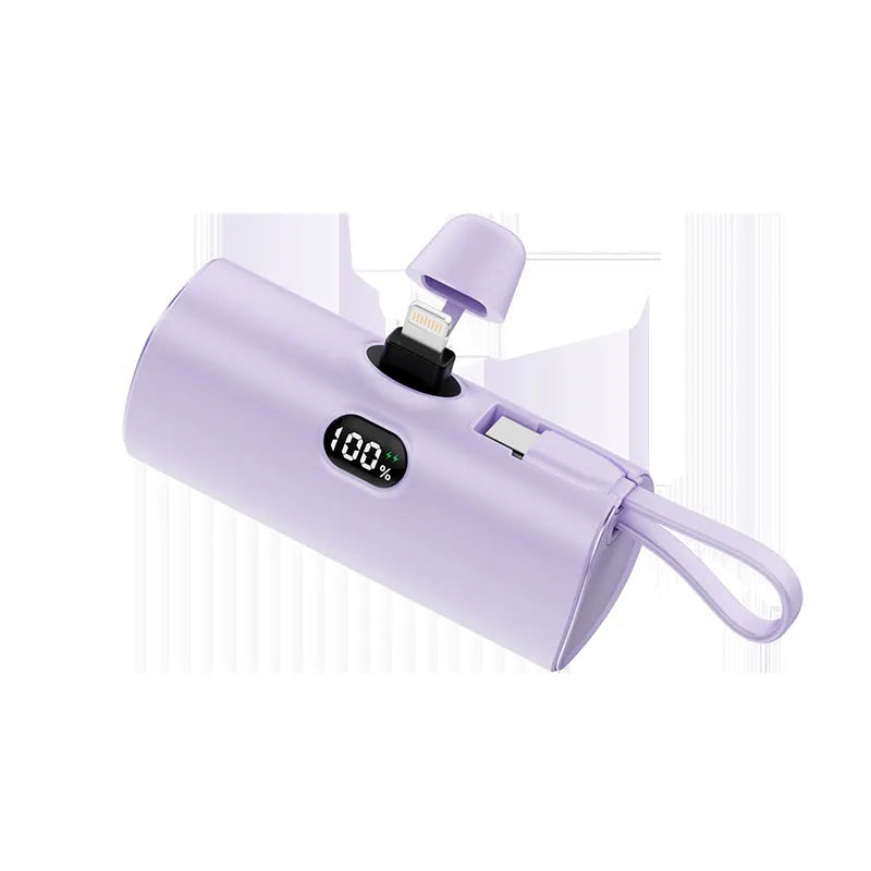 Capsule shaped wireless power bank with digital display showing battery percentage