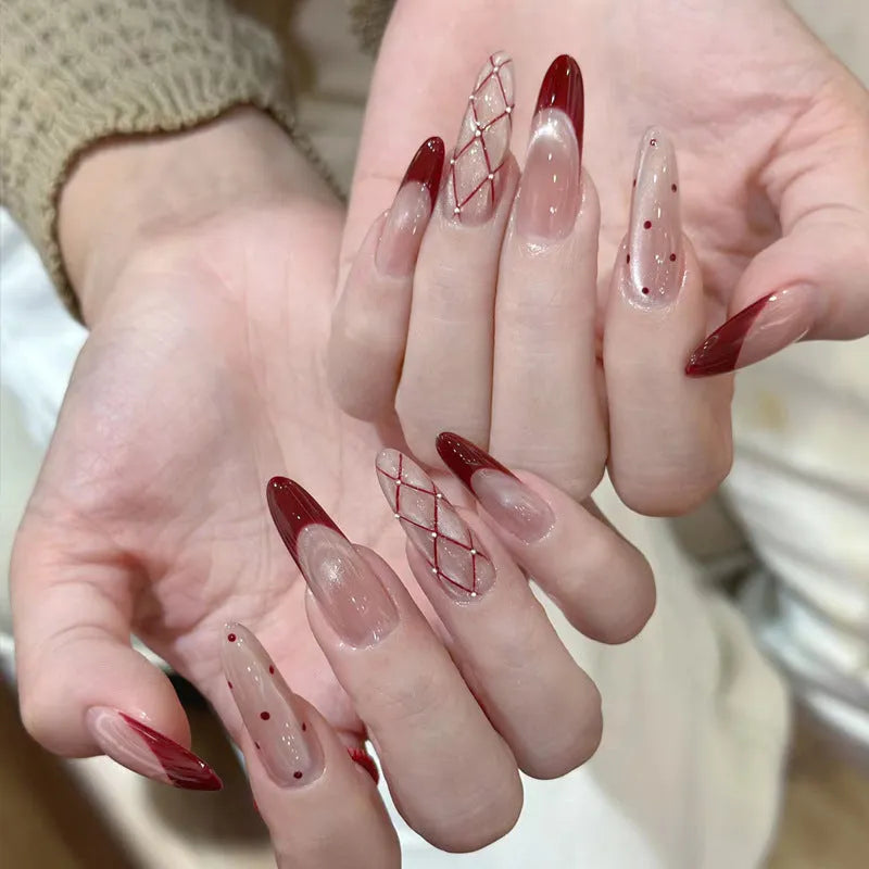Five sets of short square shaped press-on fake nails with a peel-and-stick backing, shown in assorted colours.