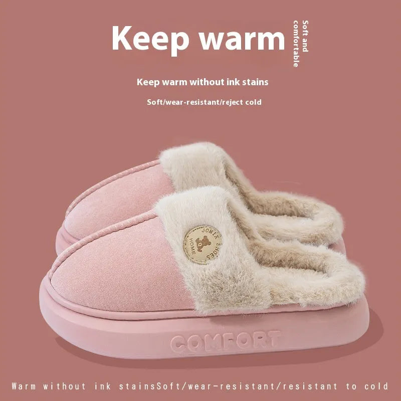 Pair of thick-soled plush fleece slippers in brown with car stitching detail on the upper.