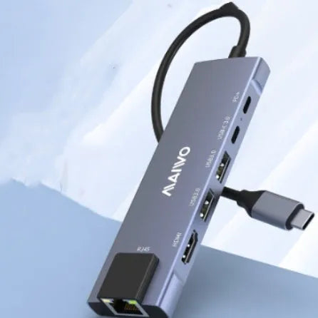 Aluminium Steam Deck docking station with HDMI, Ethernet, and USB ports on a desk