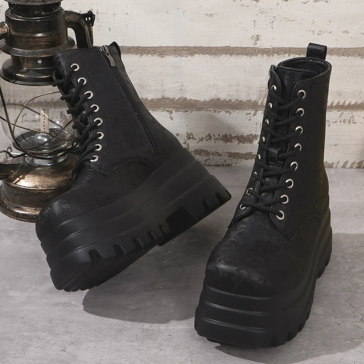 Women's white retro platform Martin boots with patchwork design and side zip.