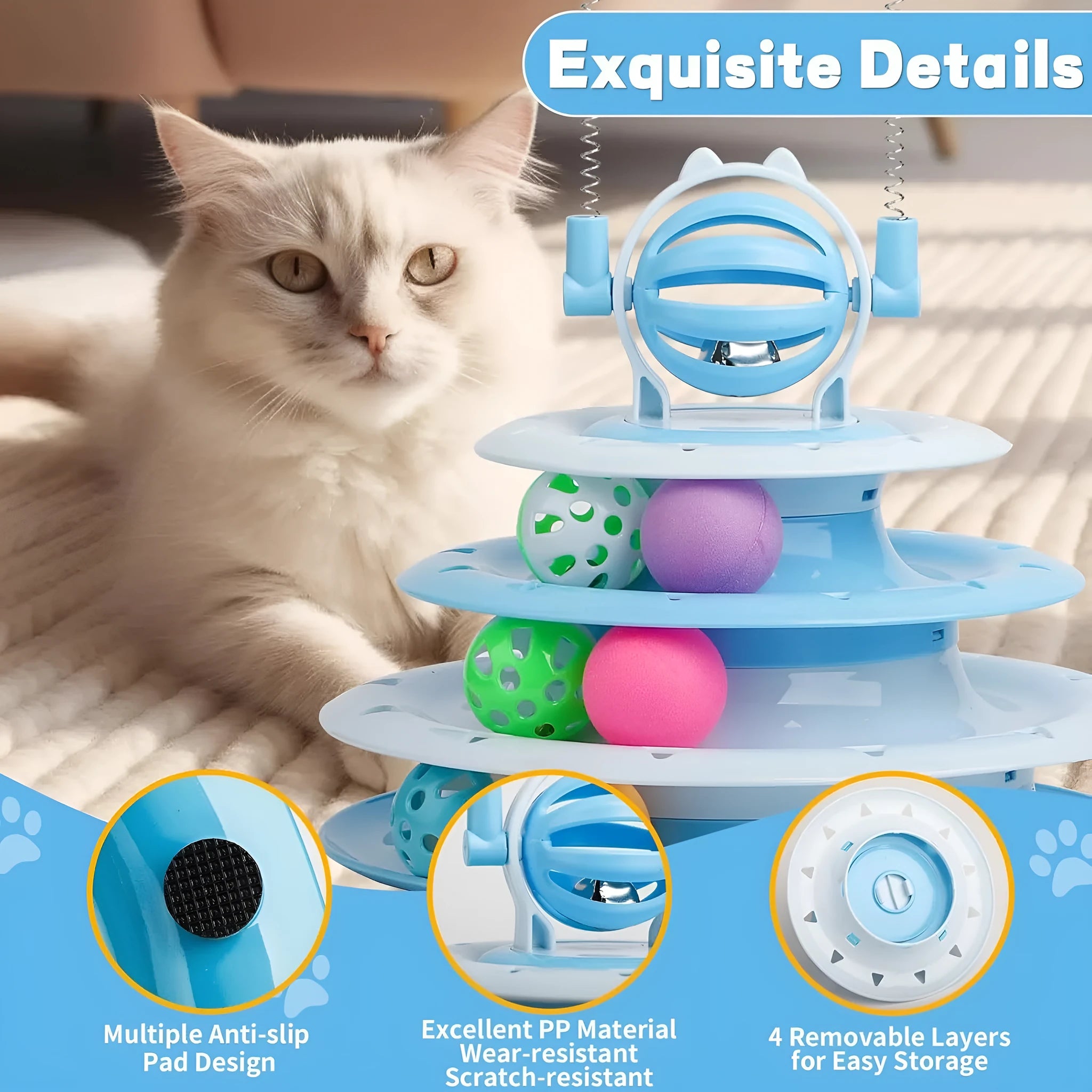 Blue four-tier interactive cat puzzle toy with rolling balls and teaser rods on a table.