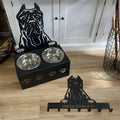 Personalised dog bowl holder with stainless steel bowl on iron dog head base showing custom name engraving