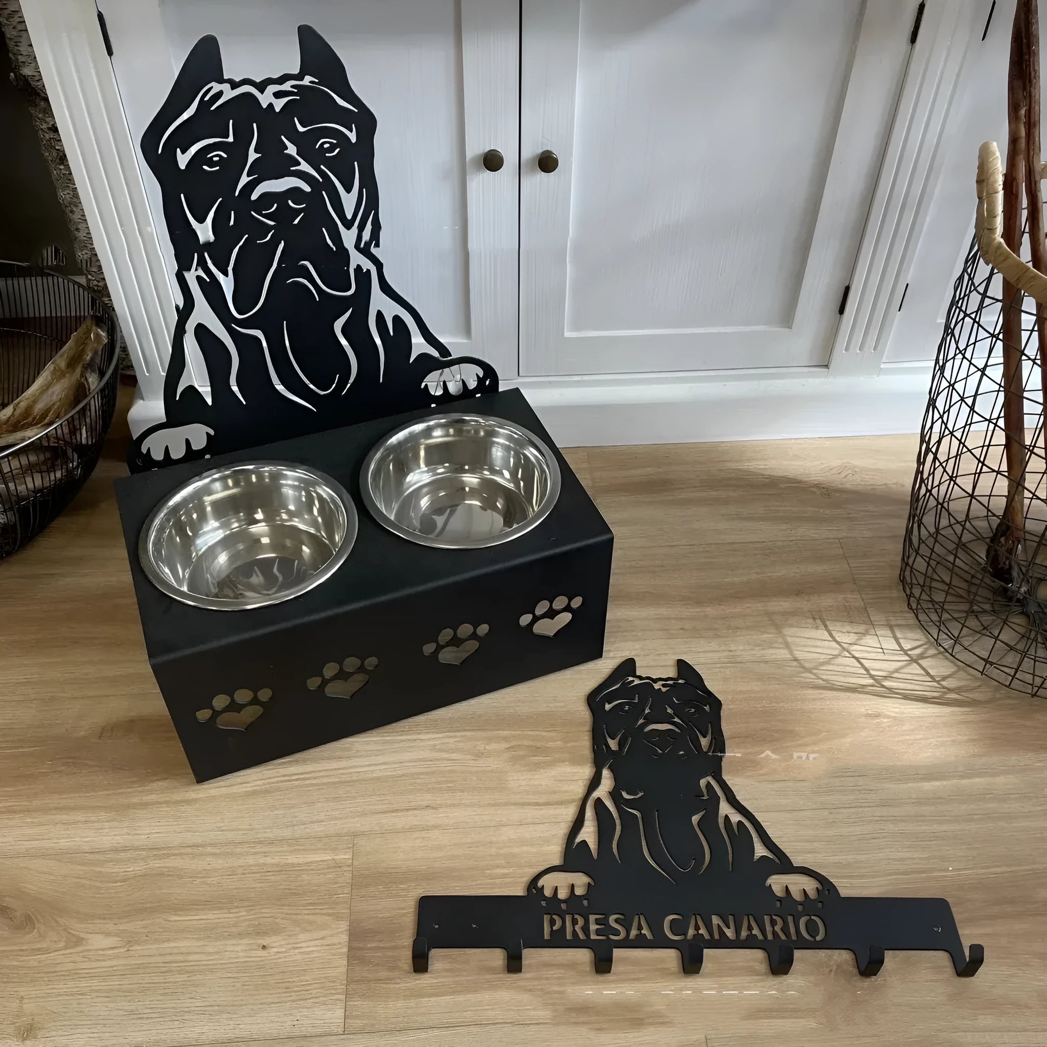 Personalised dog bowl holder with stainless steel bowl on iron dog head base showing custom name engraving