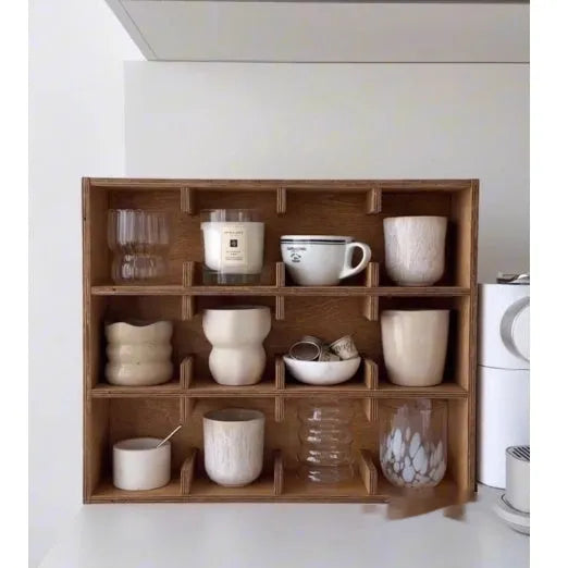 Solid birch wood multi-grid cup storage rack in meridian colour on a kitchen counter.