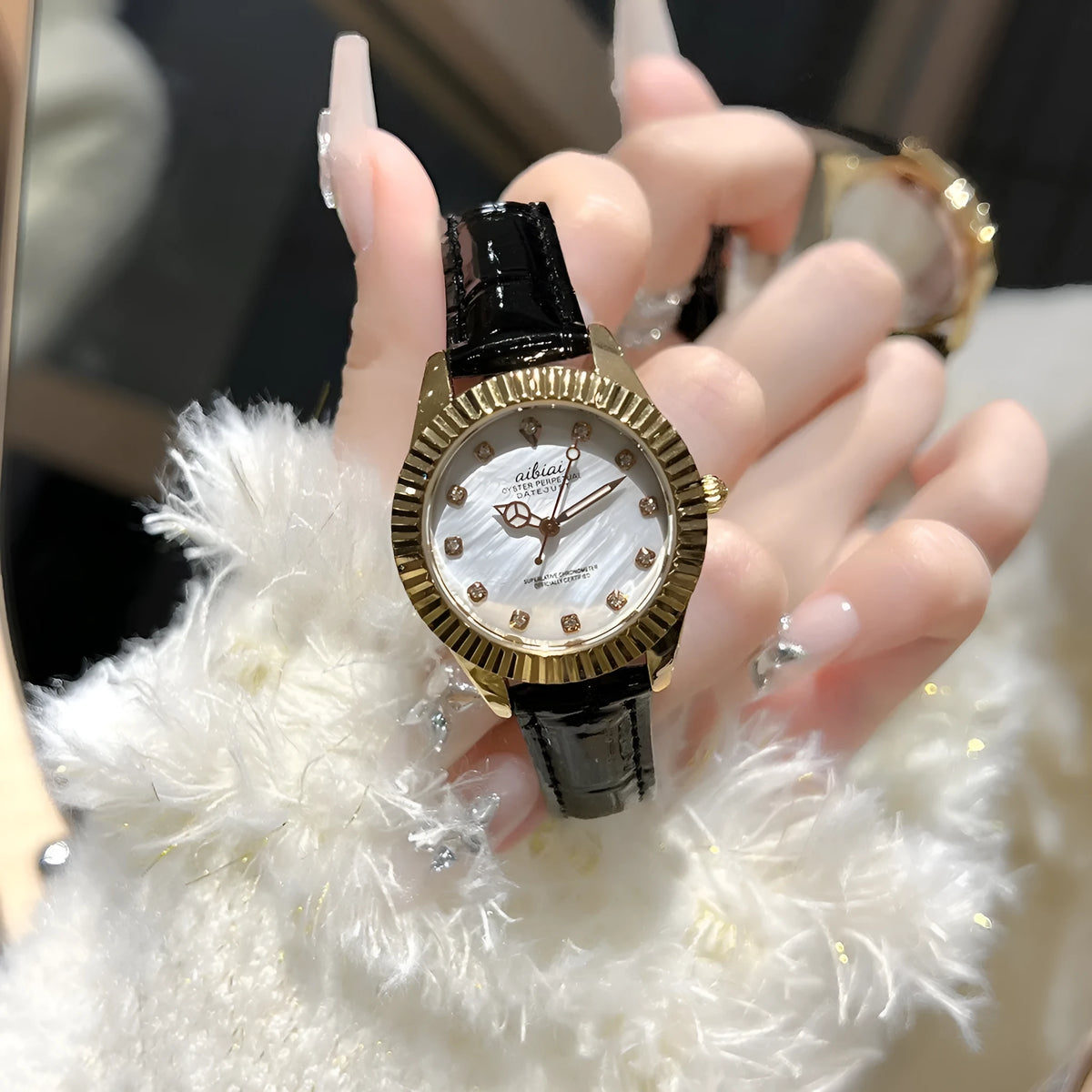 Women's rose shell dial watch with 7mm slim case, shown with leather or steel strap options