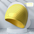 Silicone water drop style swimming cap for adults in various solid colours
