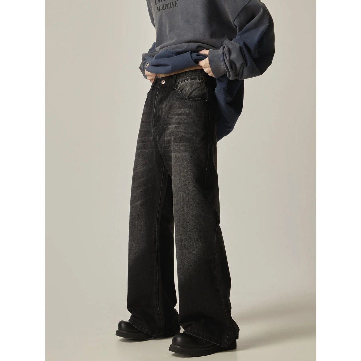 Black loose straight jeans with American retro styling and zipper fly closure