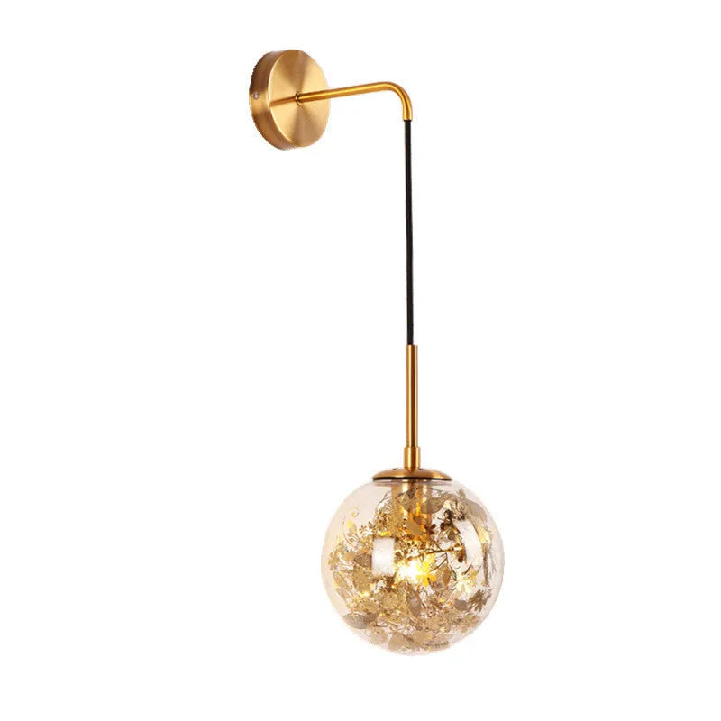 Modern glass wall lamp with metallic finish mounted beside bed for bedside lighting