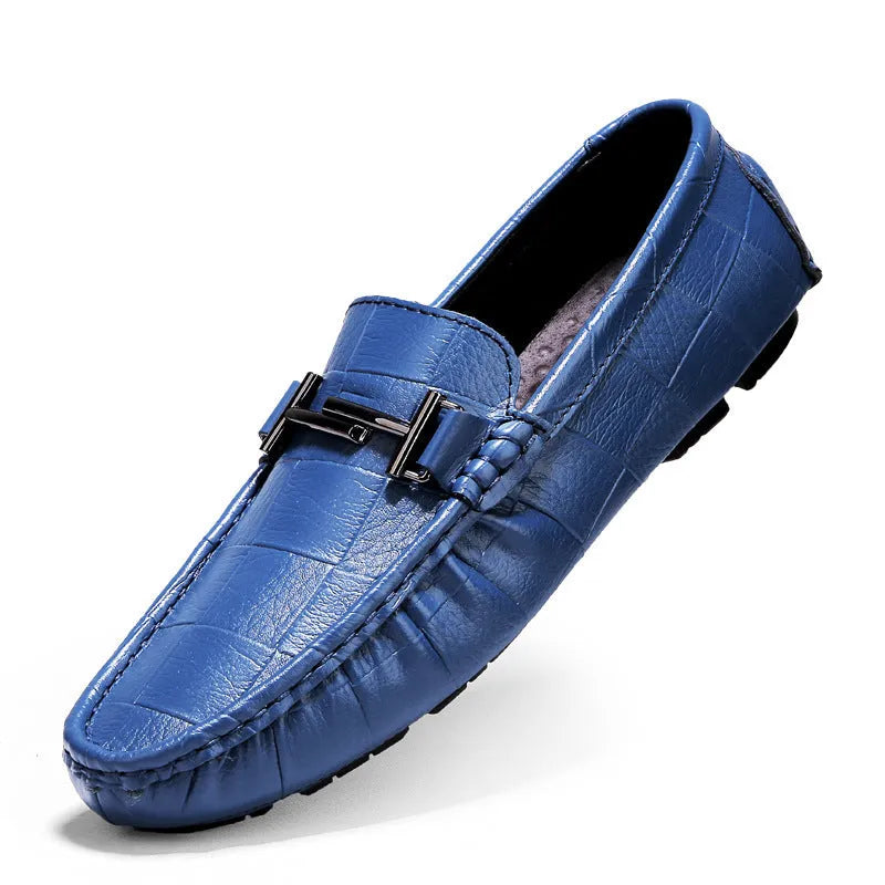 Men's black leather casual shoes with a silver buckle on a flat rubber sole.