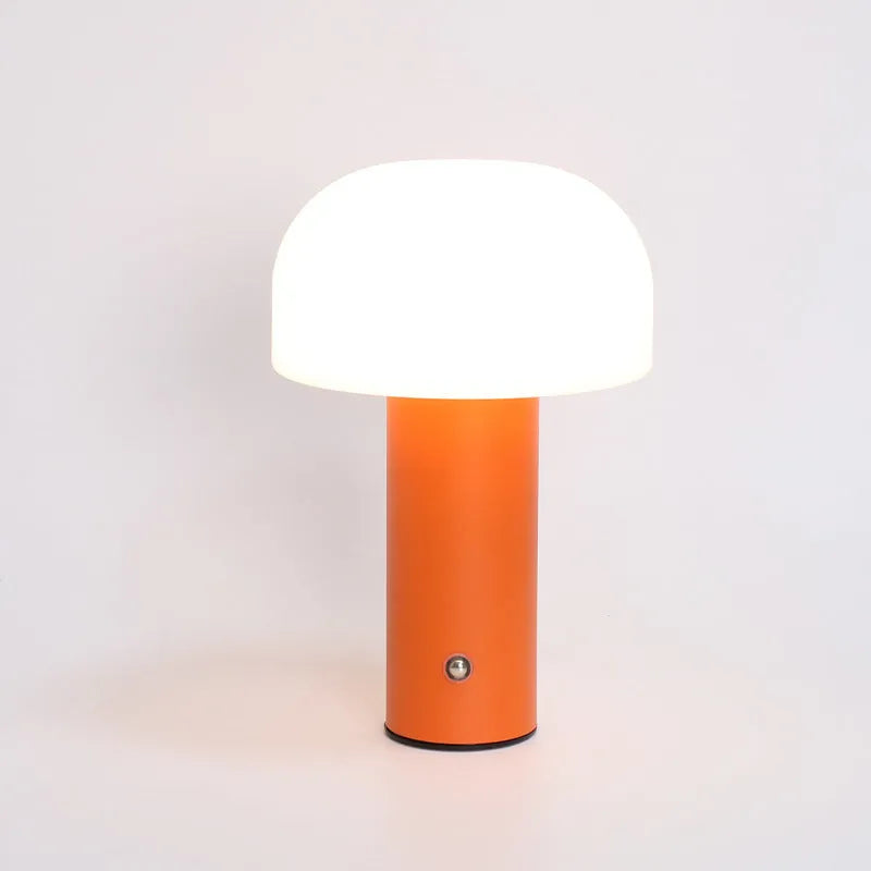 USB-powered plastic table lamp with integrated charging port in black, green, orange, or white.