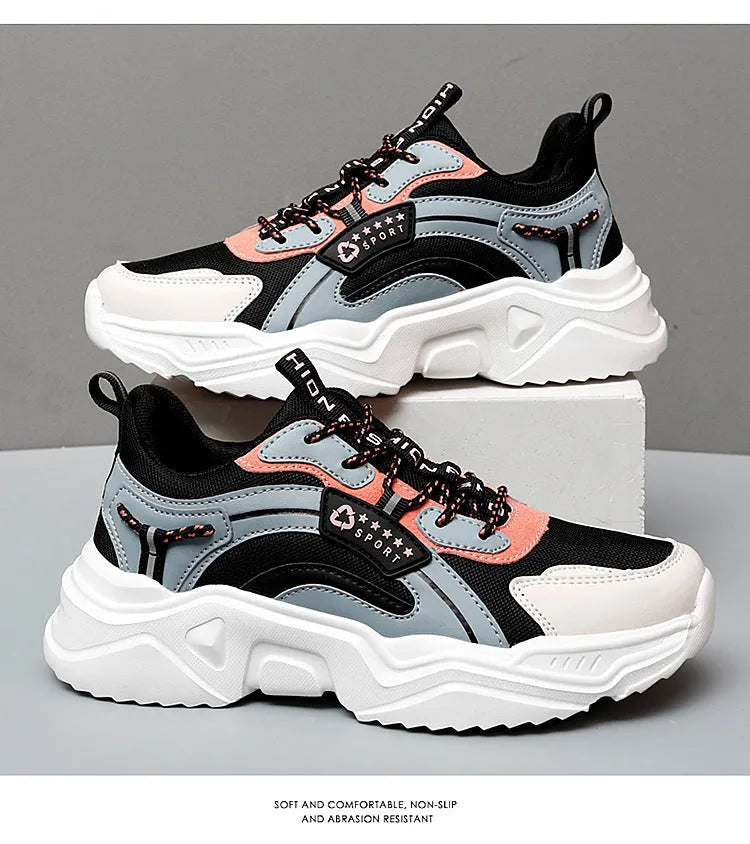 White women's casual sports shoe with mesh upper, thick PU sole, and buckle strap.
