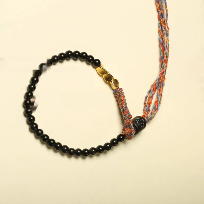 Hand-woven obsidian black wrist strap showing 4mm width and natural cord texture