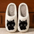 White plush slippers with Black Beard Cat cartoon couple pattern, velvet lining, and a textured non-slip sole.