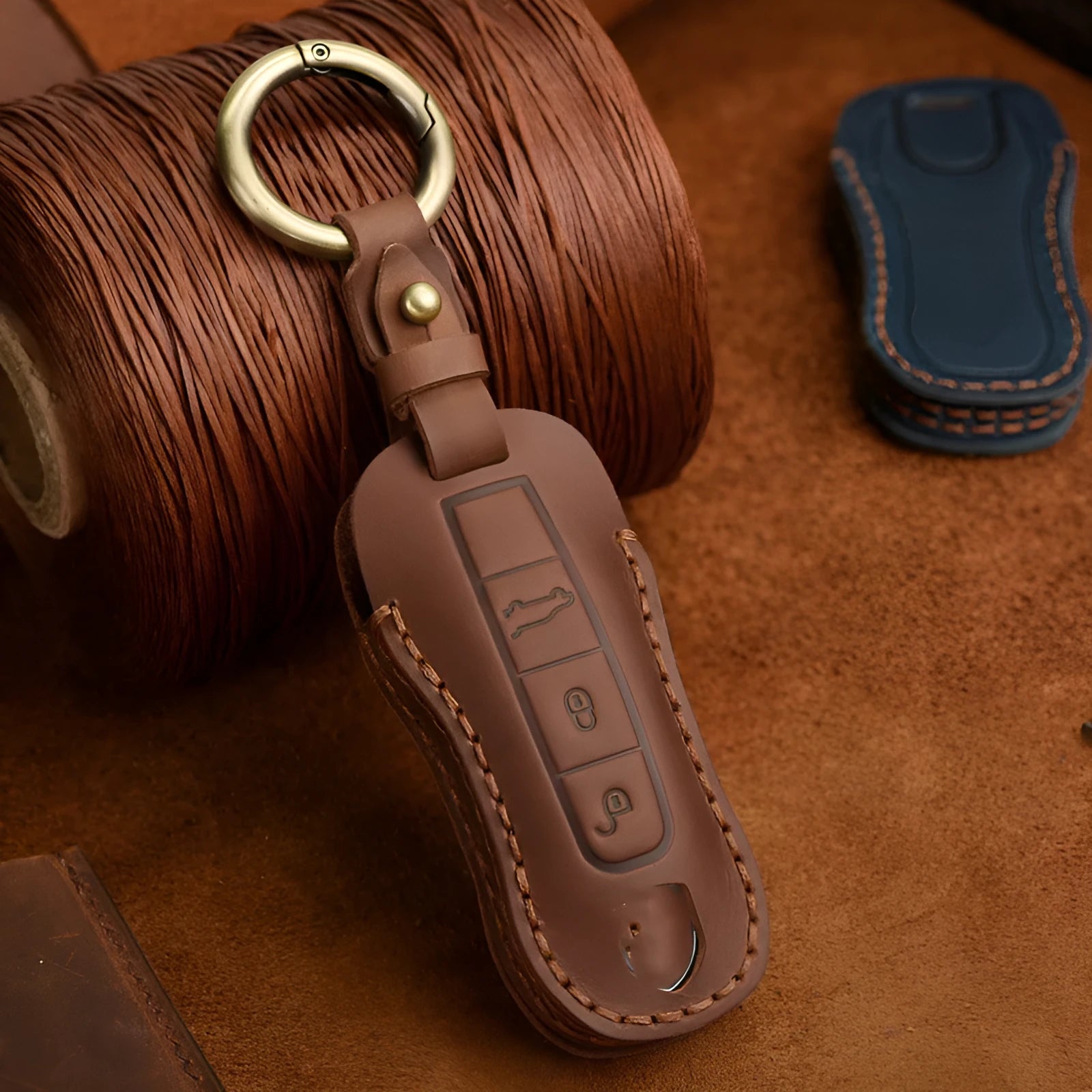 Genuine leather Porsche key cover in retro design showing blue and brown colour options