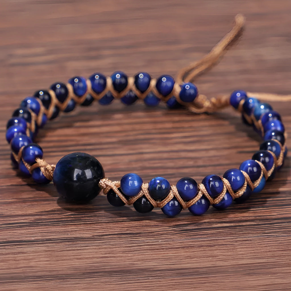 Handwoven geometric pull bracelet with blue tiger eye stone beads.