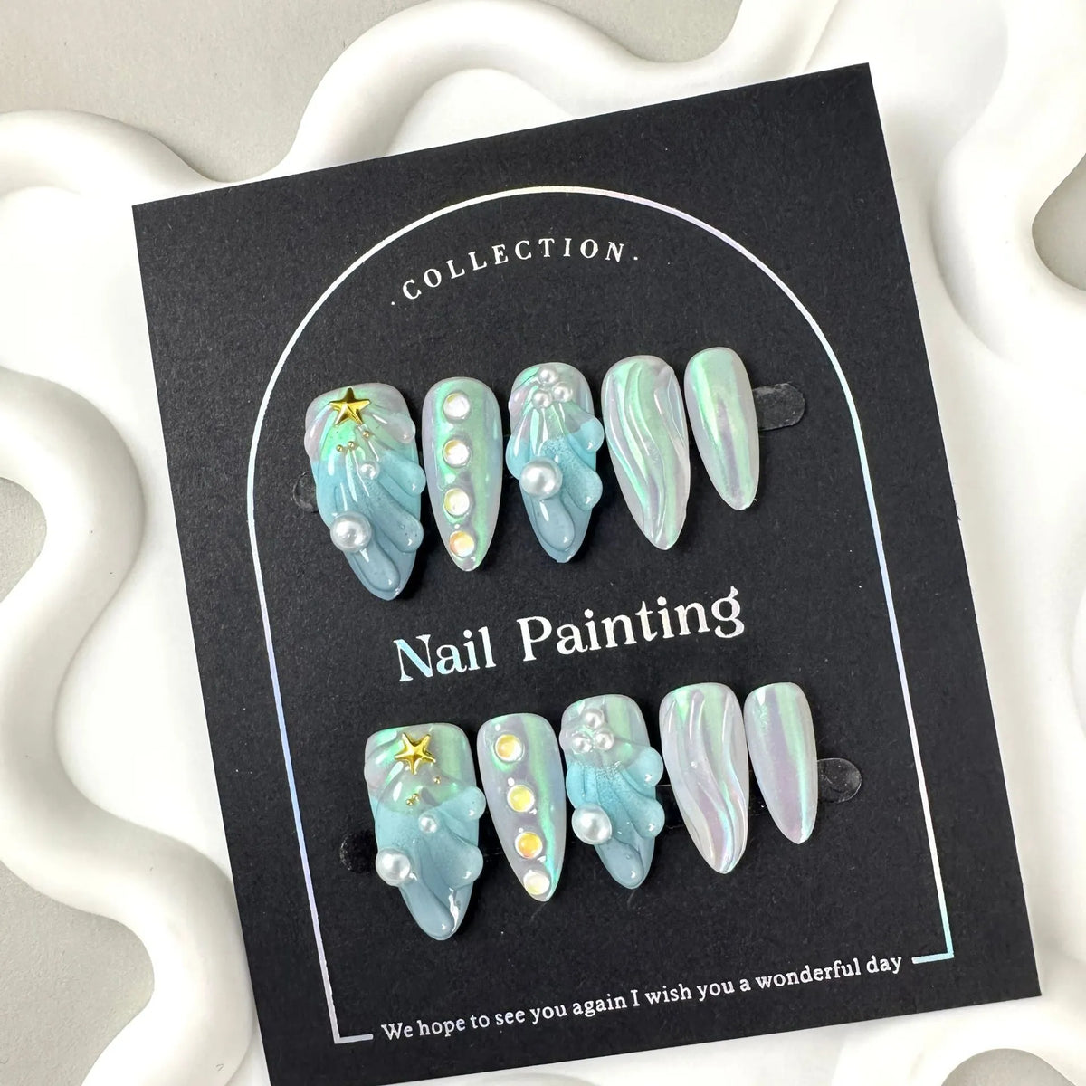 Blue shell-design plastic artificial nail tips set with four size options XS S M L