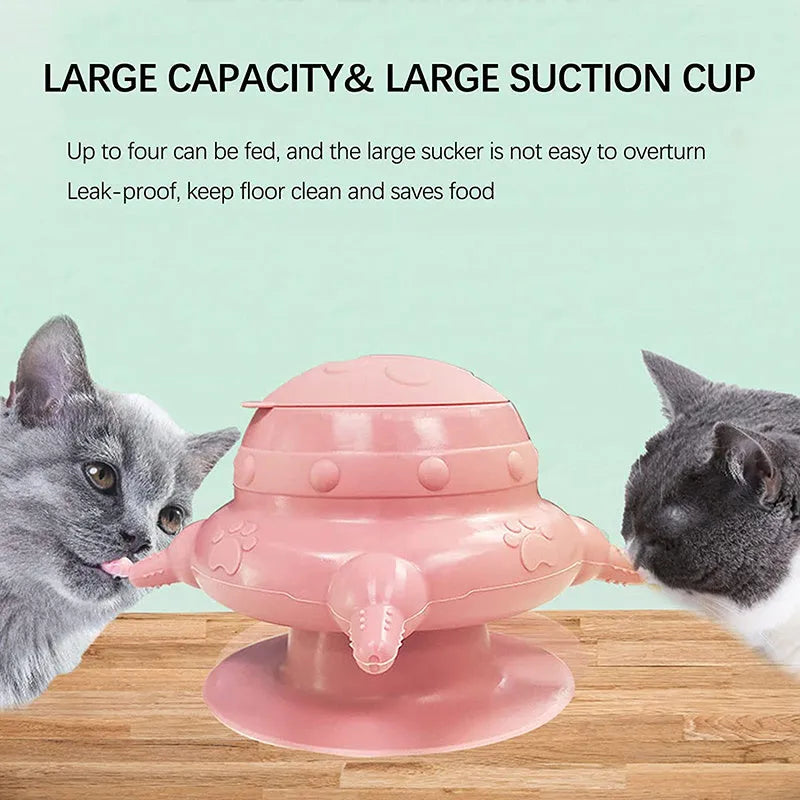 Pink silicone pet nursing device with milk bowl and four pacifiers for puppies and kittens on a flat base.