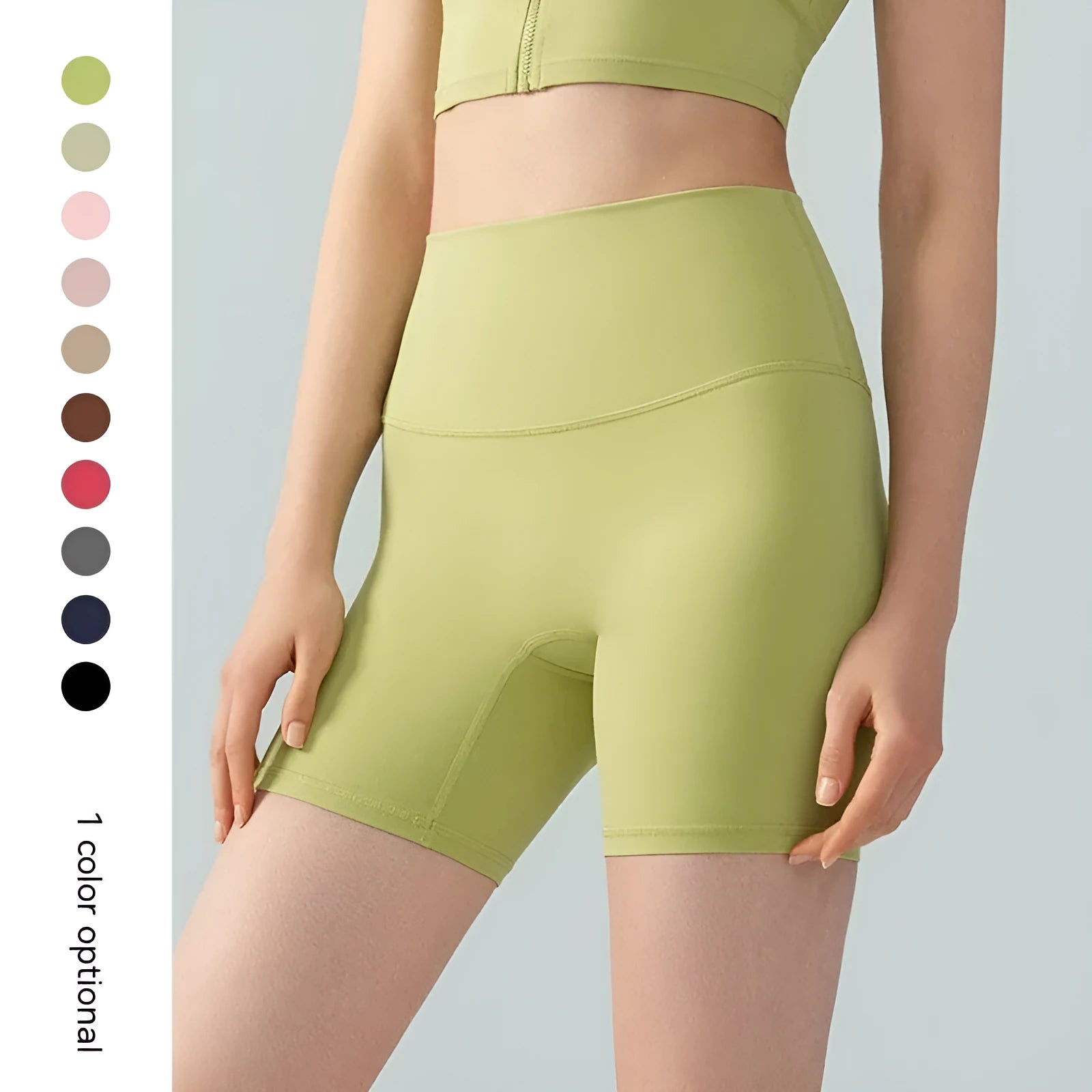 Women's leaf green high waist Lycra yoga shorts with four-point construction on a fitness background.