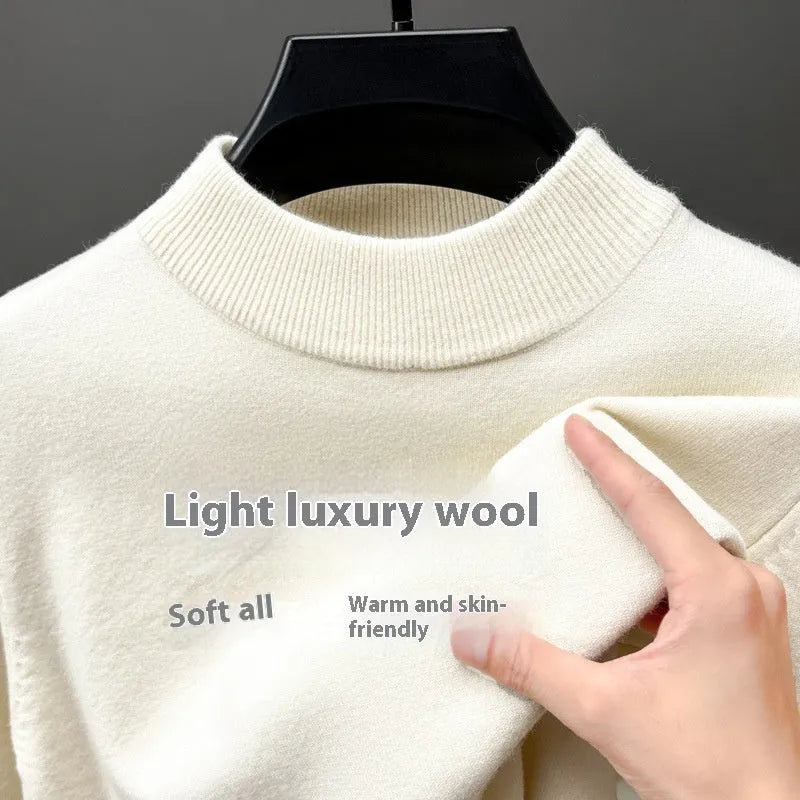 Men's solid colour half turtleneck long sleeve pullover sweater on a hanger.