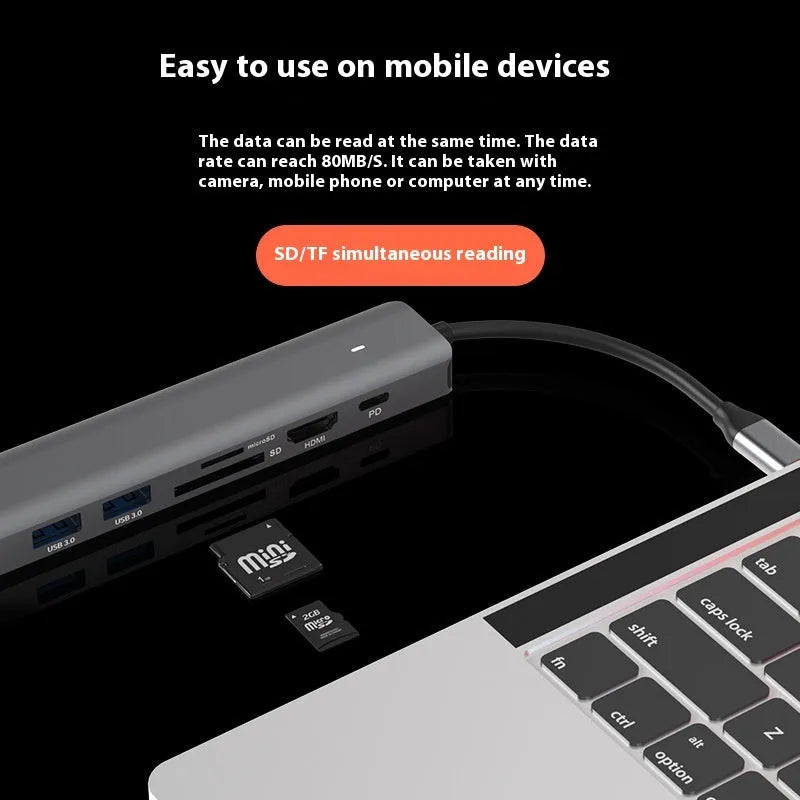 Silver LQT-LH07 7-in-1 USB-C hub and card reader for laptops showing multiple ports.