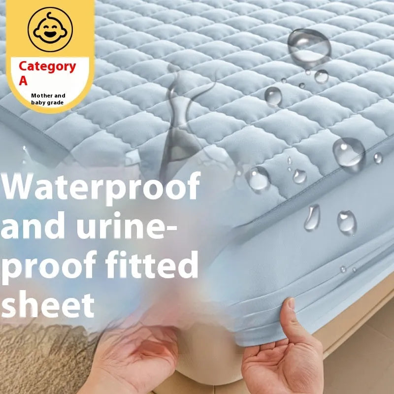 Class A waterproof washed cotton fitted sheet in light grey colour on a bed.