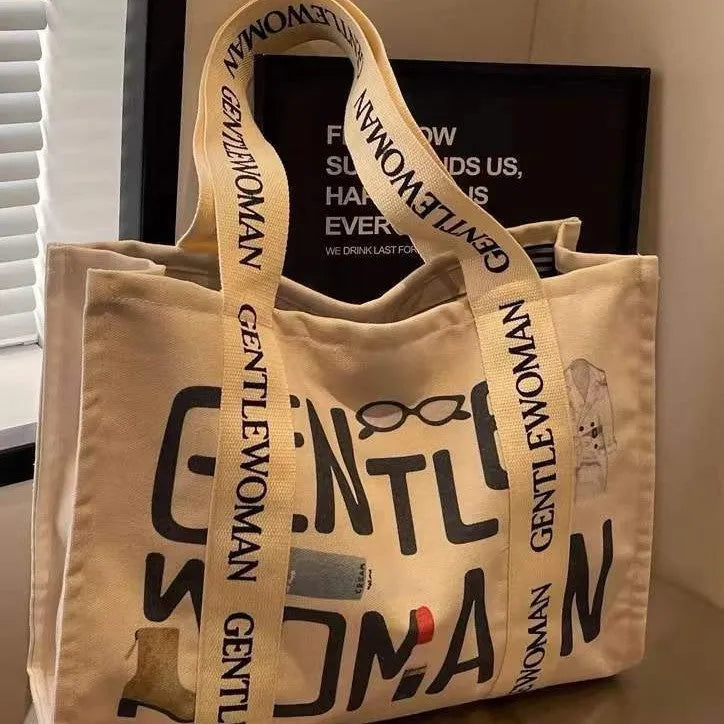 Canvas tote bag with printed design, large capacity for shopping and travel